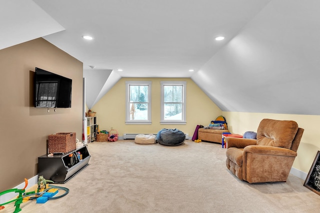 playroom featuring lofted ceiling, light colored carpet, and baseboard heating