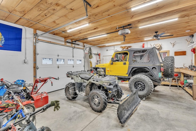 garage featuring a garage door opener and wood ceiling