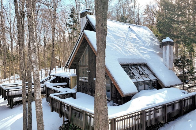 view of snow covered house