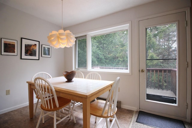 dining area featuring an inviting chandelier