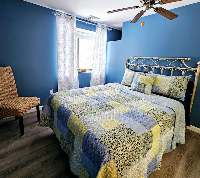 bedroom featuring dark wood-type flooring and ceiling fan