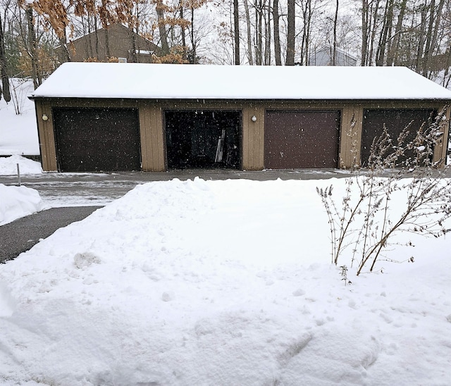 view of snow covered garage