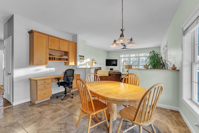 dining space with ceiling fan