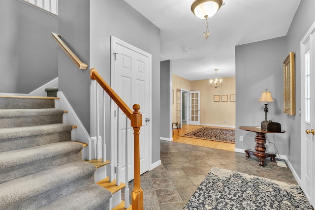 foyer featuring a notable chandelier