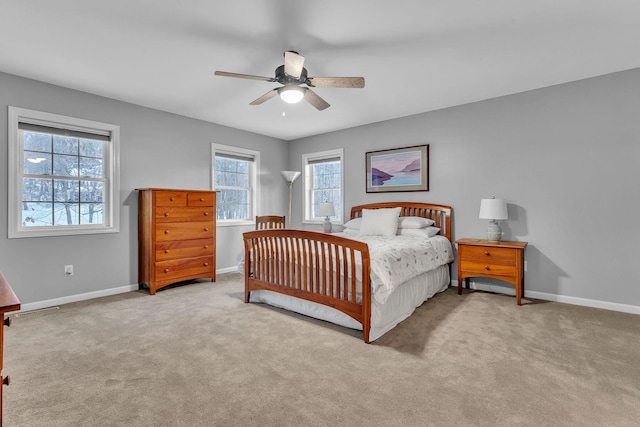 bedroom featuring light carpet and ceiling fan