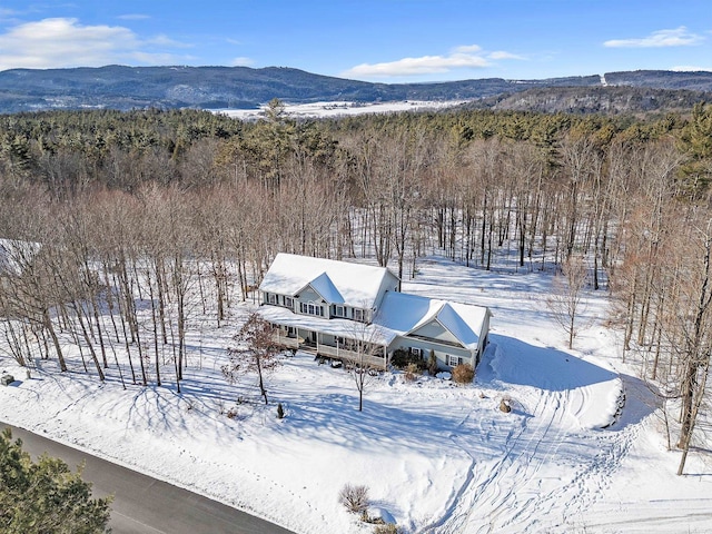 snowy aerial view featuring a mountain view