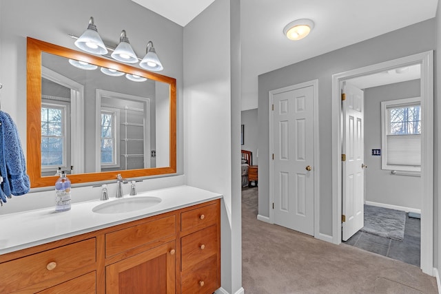 bathroom featuring a healthy amount of sunlight and vanity