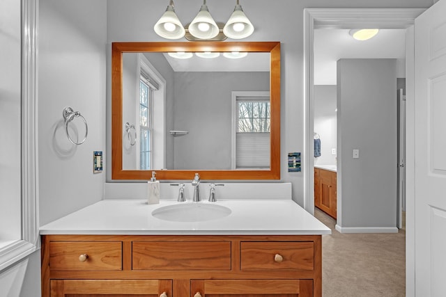 bathroom with vanity and a healthy amount of sunlight