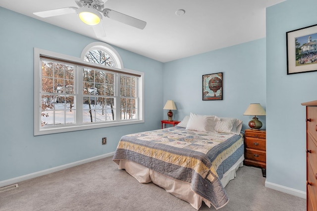 bedroom with light carpet and ceiling fan