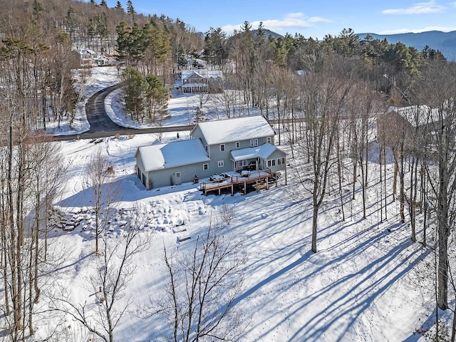 snowy aerial view featuring a mountain view