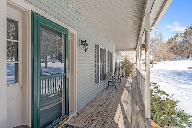 view of snow covered deck