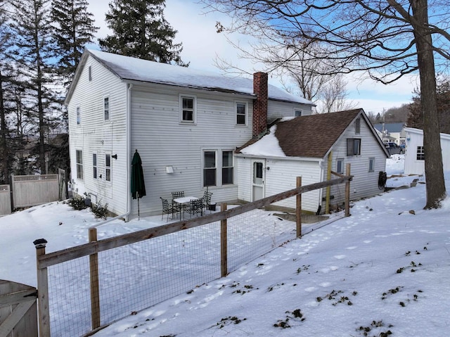 view of snow covered house