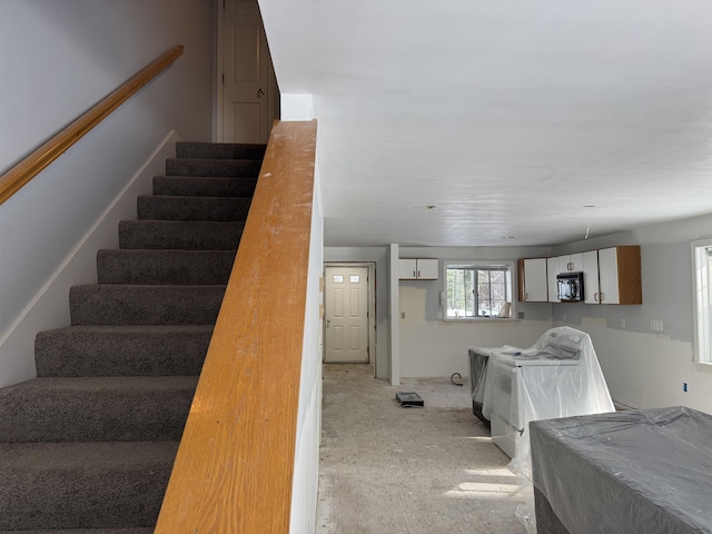 interior space featuring cabinets and independent washer and dryer