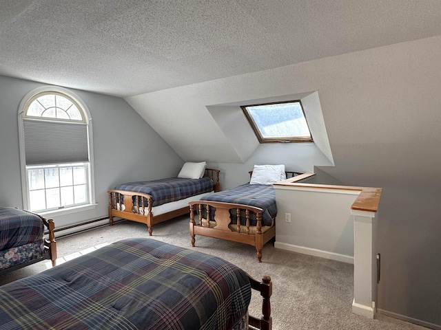 bedroom featuring baseboard heating, vaulted ceiling with skylight, light carpet, and a textured ceiling