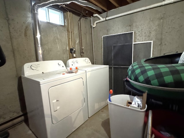 laundry room featuring washing machine and clothes dryer