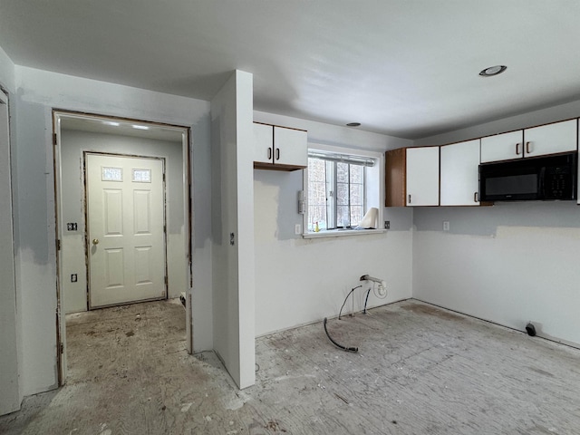 kitchen featuring white cabinets