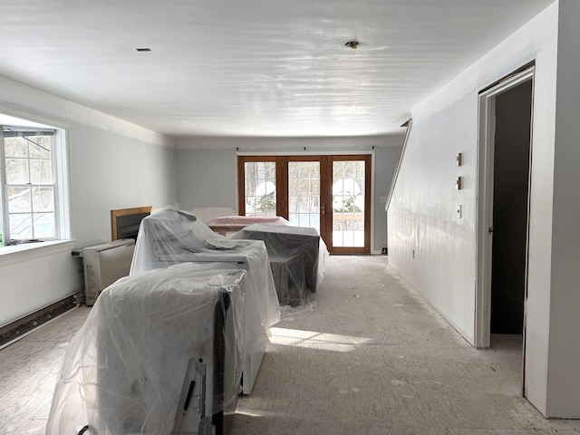 bedroom with multiple windows and french doors