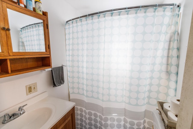 bathroom featuring vanity and a shower with shower curtain