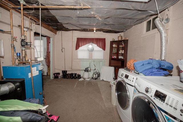 washroom with washing machine and clothes dryer