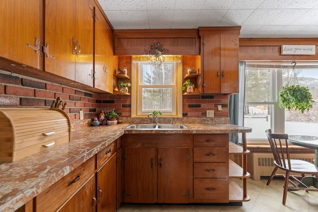 kitchen featuring radiator and sink