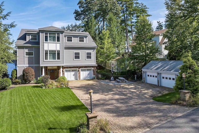 view of front facade with a garage and a front yard