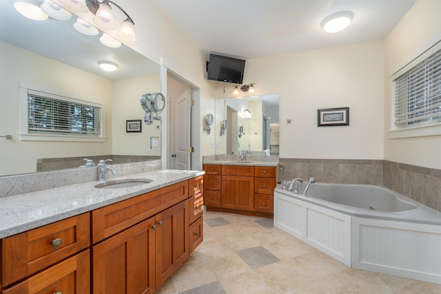 bathroom featuring vanity and a bathtub