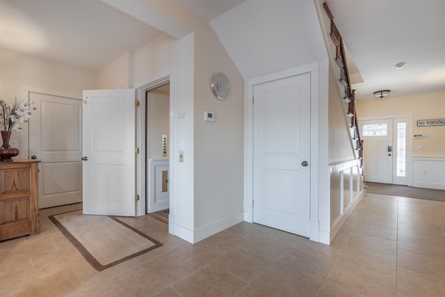 foyer entrance featuring light tile patterned flooring