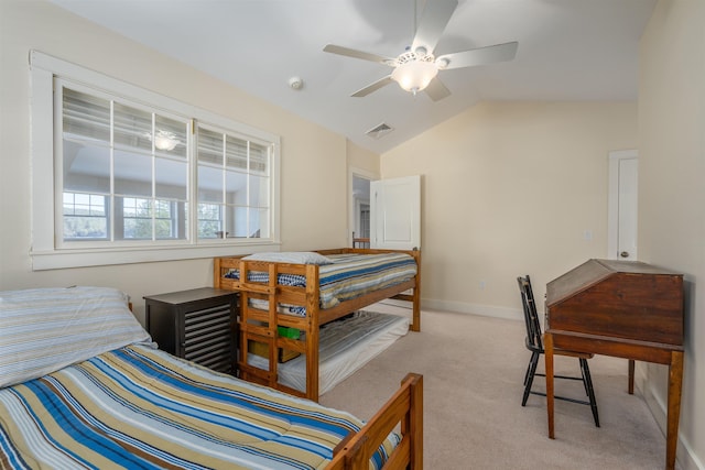 carpeted bedroom featuring lofted ceiling and ceiling fan