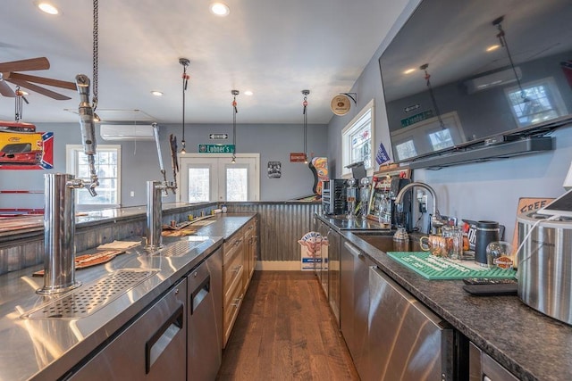 kitchen with sink, dishwasher, hanging light fixtures, dark hardwood / wood-style floors, and french doors