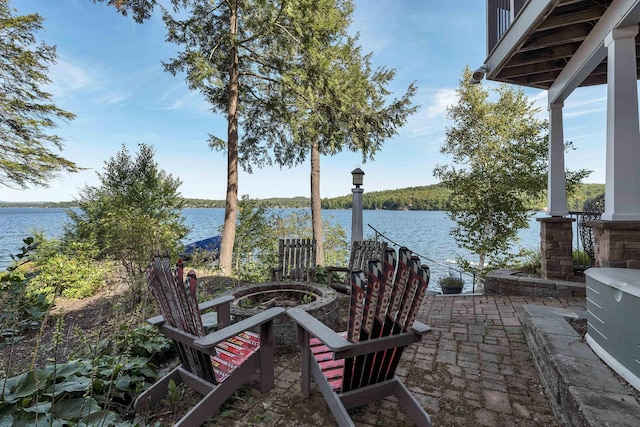 view of patio with a water view