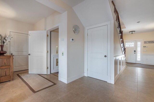 entryway featuring light tile patterned floors