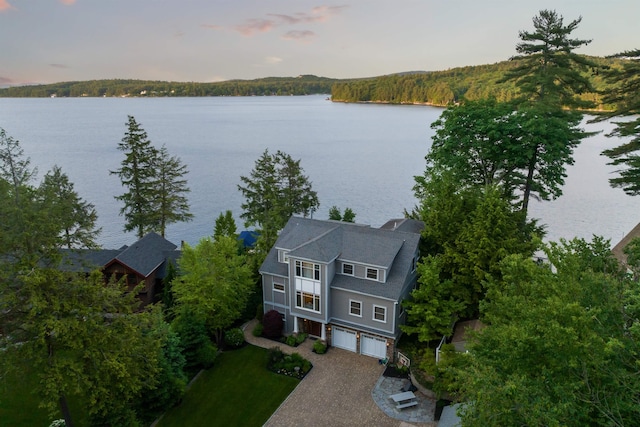 aerial view at dusk with a water view