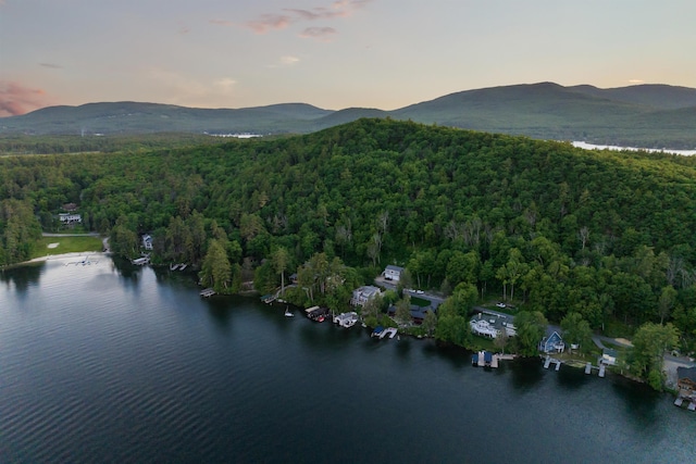 aerial view at dusk with a water and mountain view