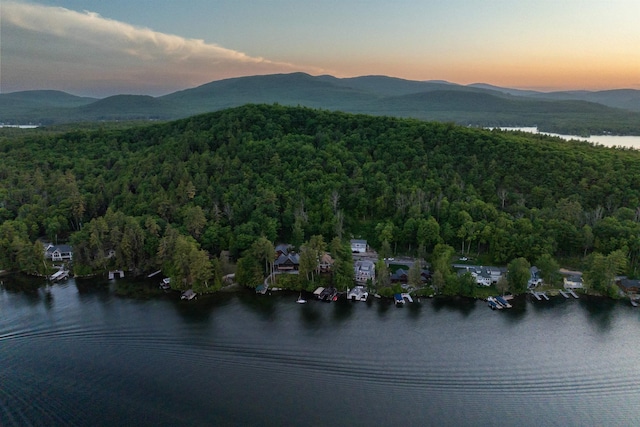 aerial view at dusk with a water and mountain view