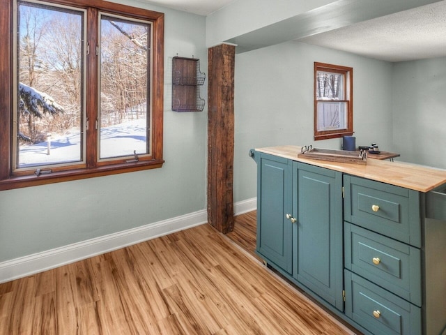 bathroom featuring hardwood / wood-style flooring and a textured ceiling