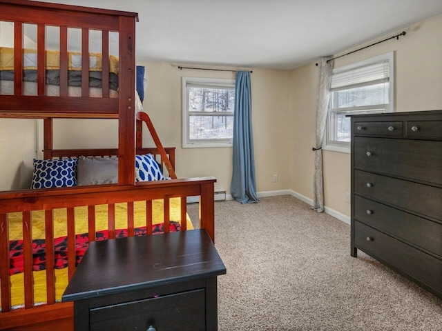 carpeted bedroom featuring baseboard heating