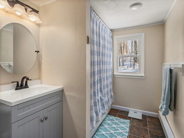 bathroom with vanity, crown molding, a shower with curtain, and a textured ceiling