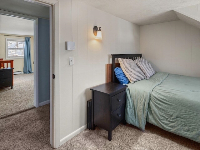 carpeted bedroom featuring a baseboard radiator