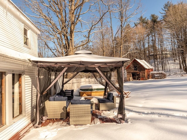 snow covered patio with a gazebo