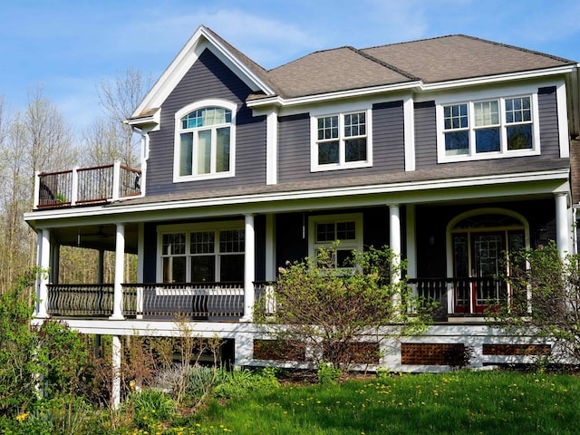 45 E Shore N, Grand Isle, VT 05458 - view of front of house with covered porch, a balcony, and a shingled roof