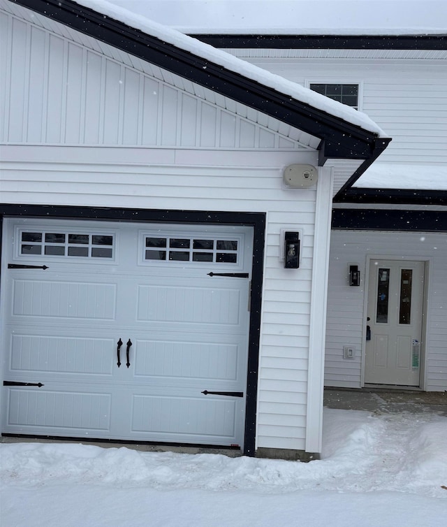 view of snow covered garage