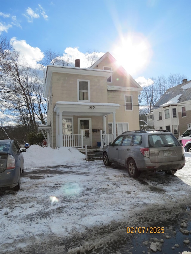 front of property featuring covered porch