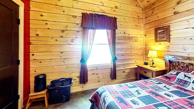 bedroom featuring wooden walls