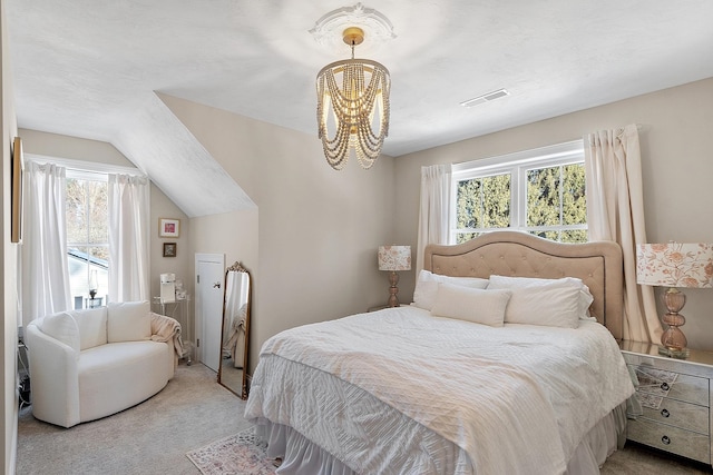 bedroom with an inviting chandelier, light colored carpet, lofted ceiling, and a textured ceiling