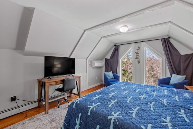 bedroom featuring lofted ceiling, hardwood / wood-style floors, and an AC wall unit