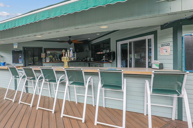 wooden terrace featuring a bar