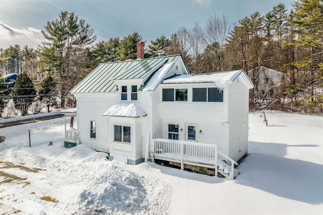 view of snow covered house