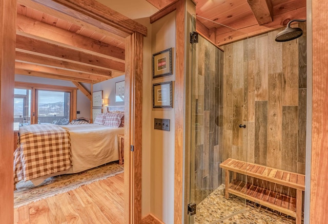 interior space with beamed ceiling and light hardwood / wood-style flooring