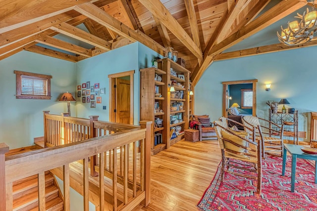 interior space featuring wooden ceiling, a chandelier, hardwood / wood-style floors, and vaulted ceiling with beams