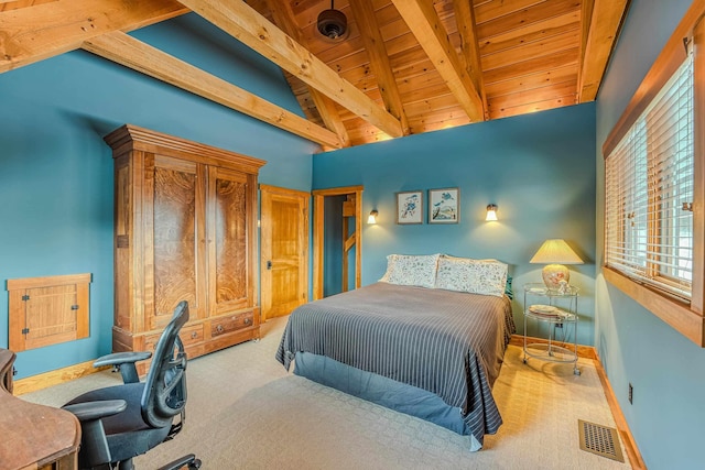 carpeted bedroom featuring wood ceiling and lofted ceiling with beams